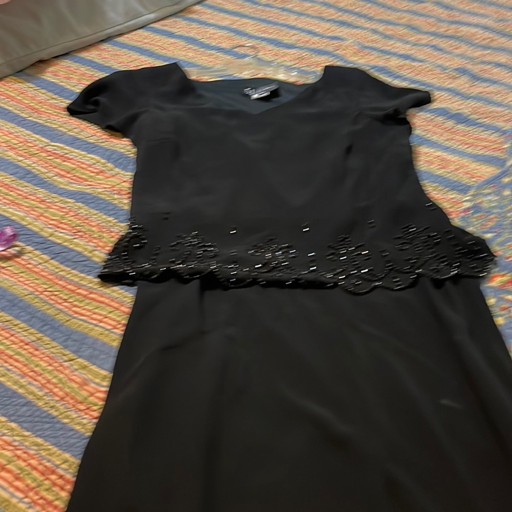 Black headed pullover dress . Never worn.